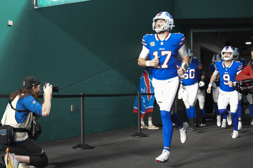 Josh Allen runs out of the tunnel to get ready to play.